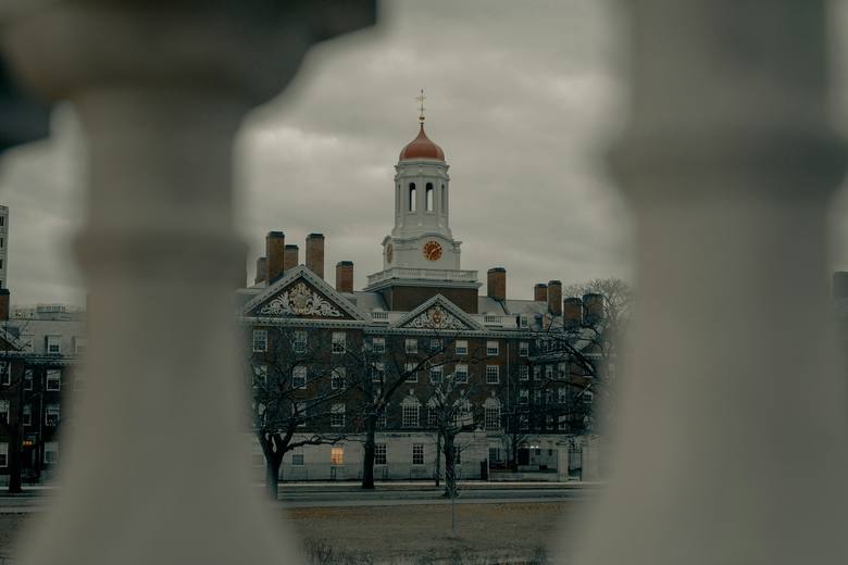 A university campus seen through a gate